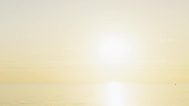 sunset timelapse over fin gulf baltic sea with small clouds and volumetric light