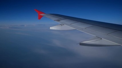 Cloudscape and plane wing