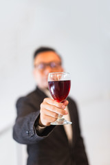 Confident businessmen holding a glass of wine.