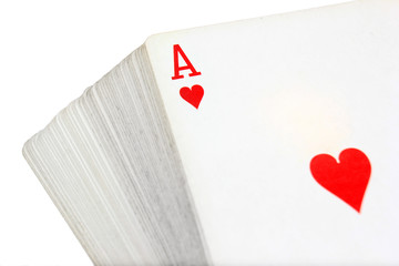 Full deck of playing cards with ace of hearts on top, isolated on white background