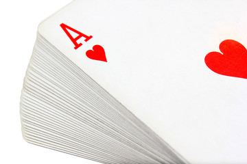 Full deck of playing cards with ace of hearts on top, isolated on white background