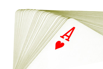 Full deck of playing cards with ace of hearts on top, isolated on white background