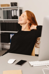 Pretty young businesswoman de-stressing