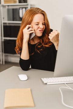 Frustrated angry businesswoman on a call