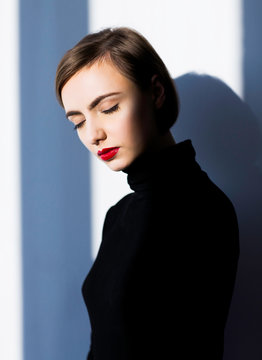 Woman standing against white background