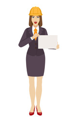 Businesswoman in construction helmet  holding a paper