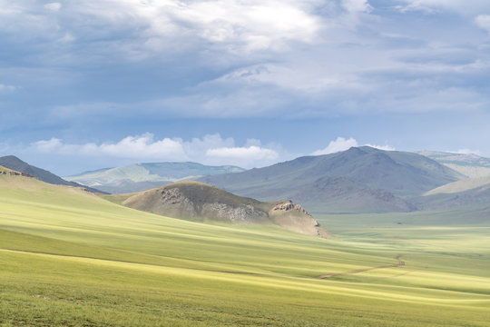 Landscape of the green Mongolian steppe under a gloomy sky, Ovorkhangai province, Mongolia