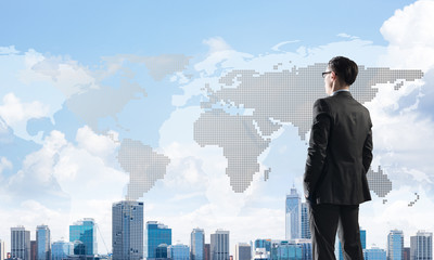 Fototapeta premium Concept of business success and control with confident boss against cityscape background