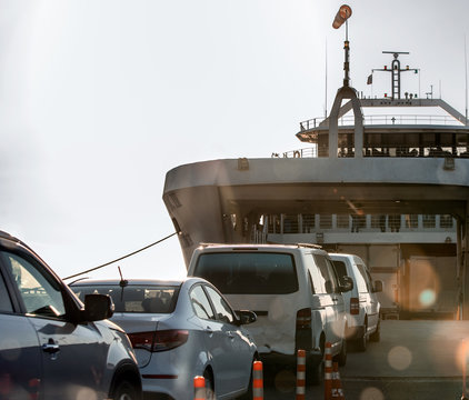 Loading of cars on the ferry for transportation to the other shore.