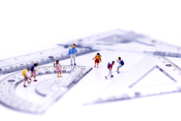Miniature people : children and student standing with stationery ,  education, math, office,designing concept.