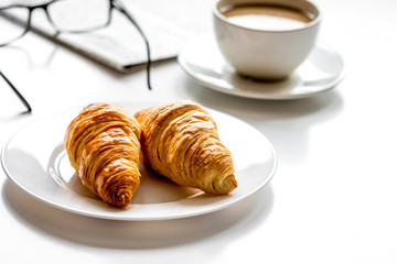 Business lunch with croissant on white table top view