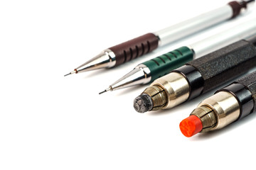 A few pencils with cores of different thicknesses and colors, isolated on a white background.