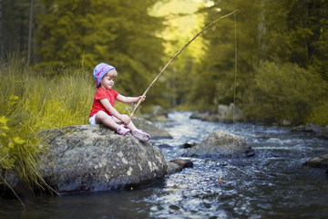 Little Girl Fishing on a Blue River