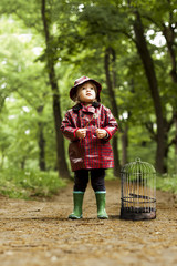 Little Girl Standing in Forest Looking for Her Lost Bird
