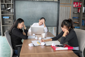 In selective focus of Business people bored in the conference room during a meeting. Setup studio shooting.