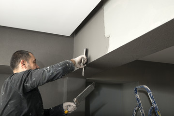 Applying Paint with Plastering Trowel     