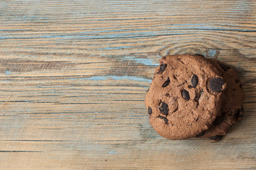 Chocolate cookies on wooden table.
