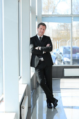 serious businessman standing in corridor of the office.