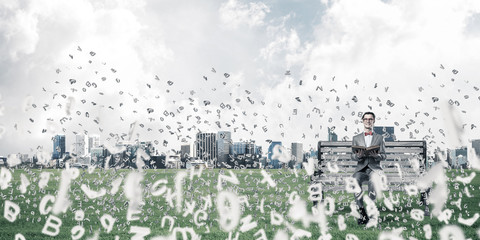 Young businessman or student studying the science and symbols fl