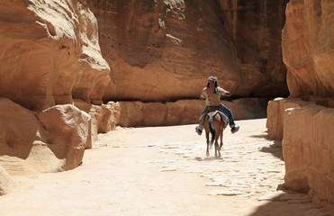 Beduin riding through Petra, Jordan