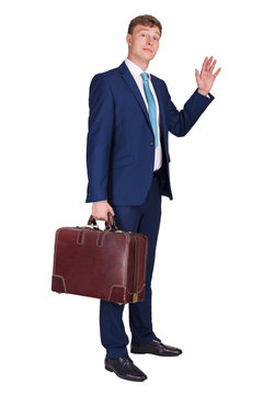 Businessman full body, holding suitcase and waving to goodbay, isolated over white background.