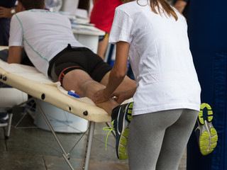 Athlete's Calf Muscles Massage after Sport Workout