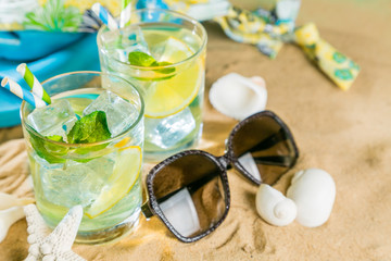 Summer drink on sand beach