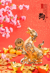 Chinese new year decoration:golden dog statue and gold ingots,translation of calligraphy: 2018 is year of the dog,red stamp: good Fortune for new year