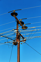 power line with electrical pole in the clear sky