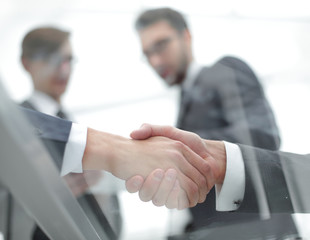 Business men shaking hands. Closeup.