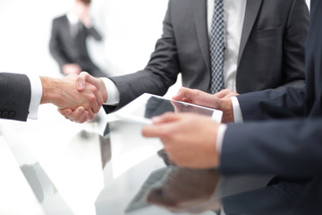 Fototapeta premium Two confident businessmen shaking hands during a meeting in the