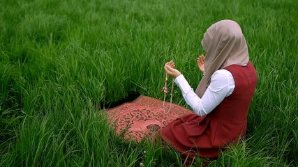Praying and muslim girl