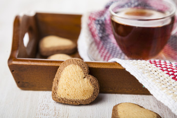 Heart-shaped cookies and tea