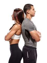 Happy team of bodybuilders. Portrait of happy fit healthy couple with crossed hands