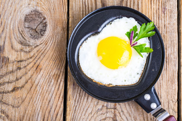 Fried eggs, salad and coffee for breakfast for Valentine's Day