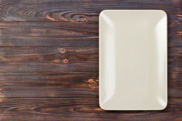 empty rectangular Plate on wooden table background