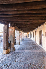 Fototapeta na wymiar Old buildings of the village of Riaza, Segovia, still with remnants of winter snow