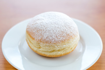 Sweet Polish paczek on a dessert.