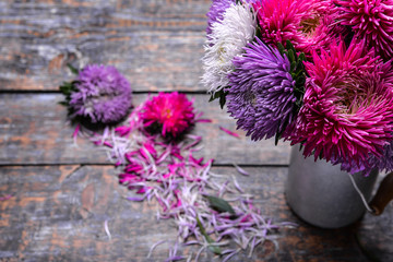 Aster flowers bouquet purple red pink white on a wooden background. selective focus