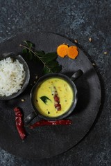 Spiced Turmeric Buttermilk curry served with rice, selective focus