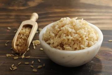 Cooked Whole grain brown rice served in a bowl, selective focus
