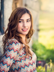 Fototapeta premium Young happy attractive woman posing in sunset