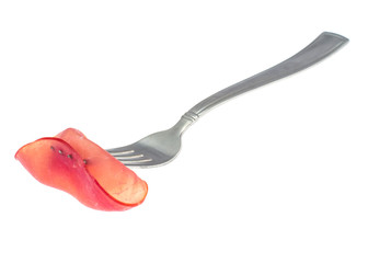 Slice of smoked ham on fork