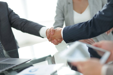 confident handshake of business partners