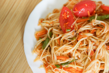 Somtam - Thai famous papaya salad on dish