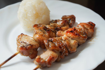 Grilled chicken black pepper sauces and sticky rice on dish