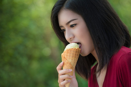 Asian women are eating mud ice cream.
