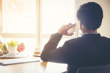 Businessman talking on the phone in office