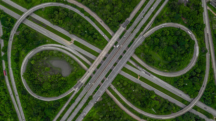 Aerial view highway junction, cross roads, interchange and expressway is an important infrastructure in Thailand.