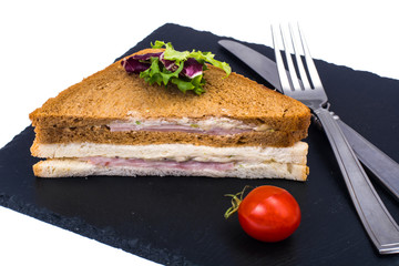 Sandwich with ham and cheese from wheat and rye bread